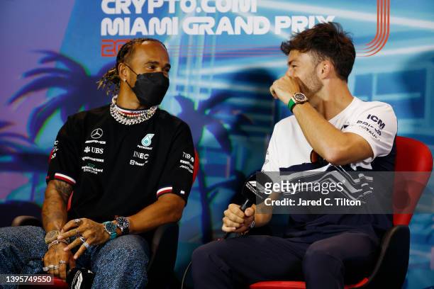 Lewis Hamilton of Great Britain and Mercedes and Pierre Gasly of France and Scuderia AlphaTauri talk in the Drivers Press Conference prior to...