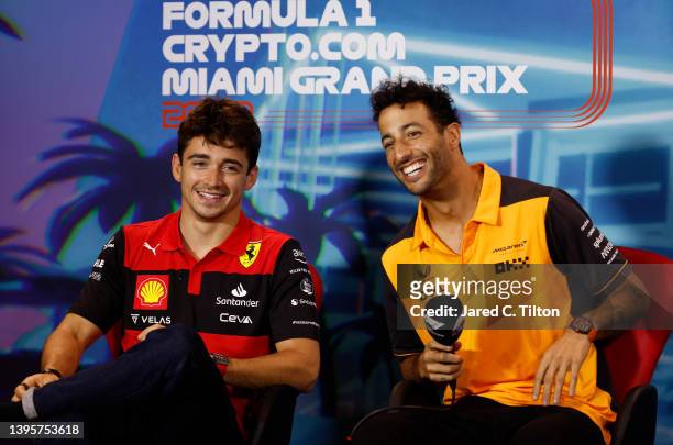 Charles Leclerc of Monaco and Ferrari and Daniel Ricciardo of Australia and McLaren smile in the Drivers Press Conference prior to practice ahead of...