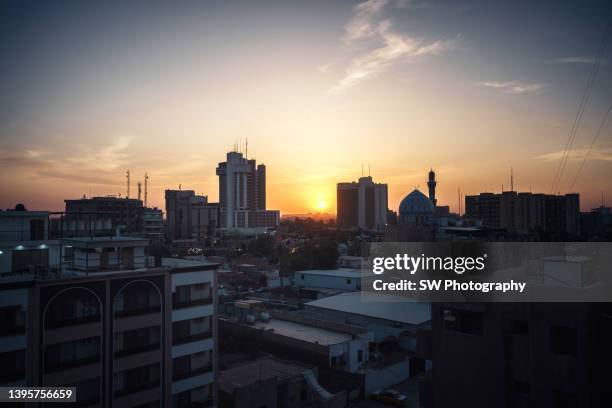 baghdad cityscape in the sunset - baghdad aerial stock pictures, royalty-free photos & images