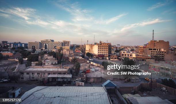 baghdad cityscape in the sunset - baghdad aerial stock pictures, royalty-free photos & images