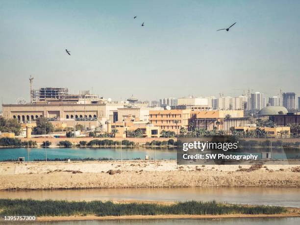 mobile device photo of the baghdad cityscape and tigris river - baghdad stock pictures, royalty-free photos & images
