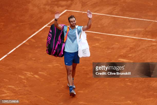 Rafael Nadal of Spain acknowledges the crowd as he leaves the court following his defeat in their quarter-final match against Carlos Alcaraz Garfia...