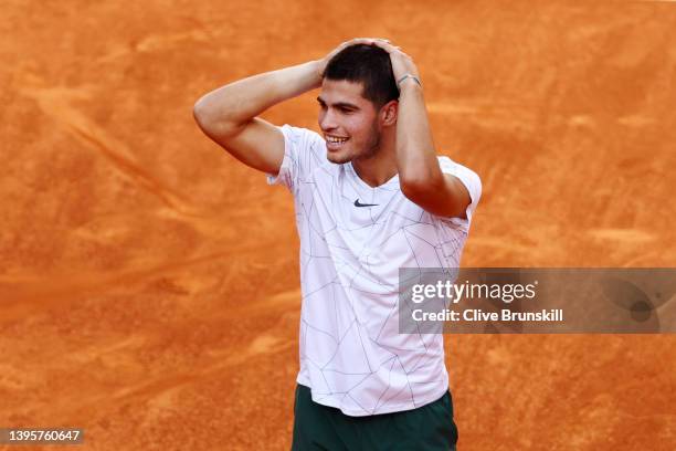 Carlos Alcaraz Garfia of Spain celebrates victory in their quarter-final match against Rafael Nadal of Spain during day nine of Mutua Madrid Open at...