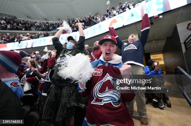 Fans of the Colorado Avalanche cheer against the Nashville Predators in Game Two of the First Round of the 2022 Stanley Cup Playoffs at Ball Arena on...