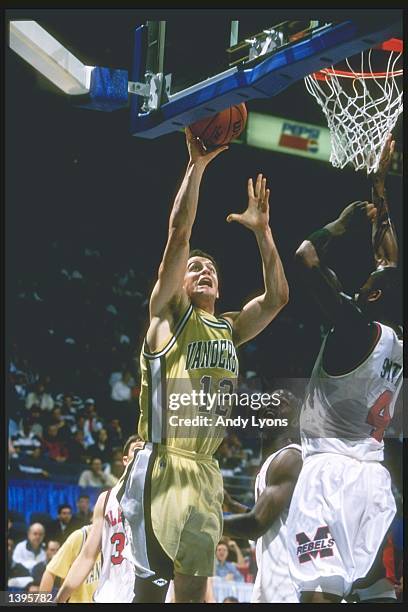 Center Austin Bates of the Vanderbilt Commodores goes up for two as forward Jason Smith of the Mississippi Rebels tries to block during an SEC...