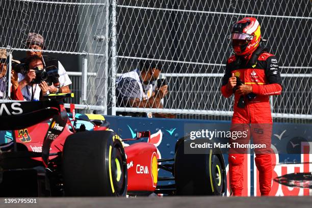 Carlos Sainz of Spain and Ferrari walks away from his car after crashing during practice ahead of the F1 Grand Prix of Miami at the Miami...