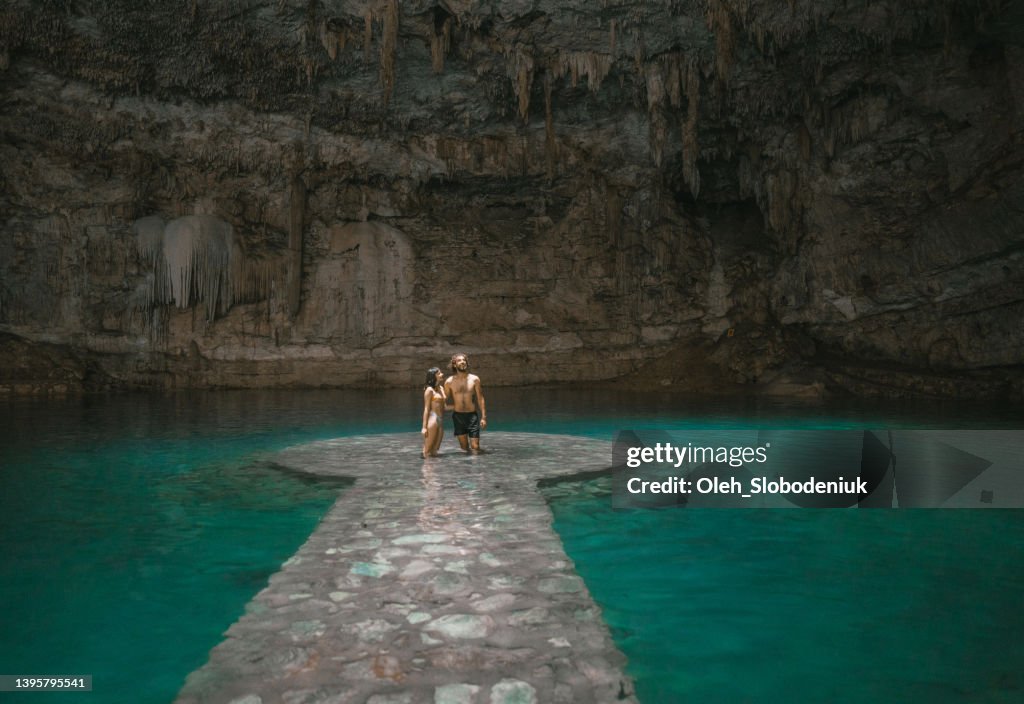 Couple standing in Cenote in Yucatan, Mexico