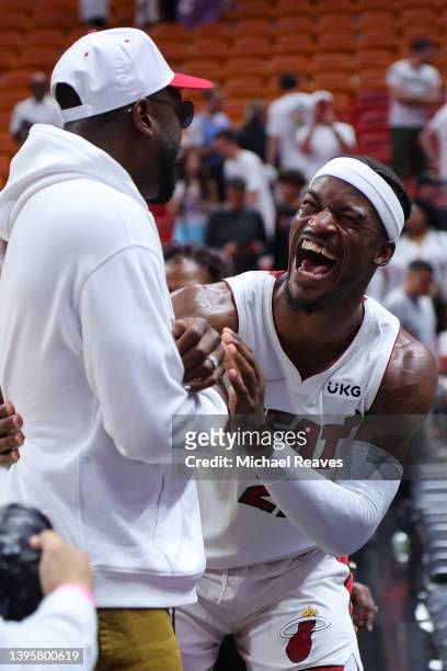 Jimmy Butler of the Miami Heat hugs former Miami Heat player Dwyane Wade after Game Two of the Eastern Conference Semifinals against the Philadelphia...