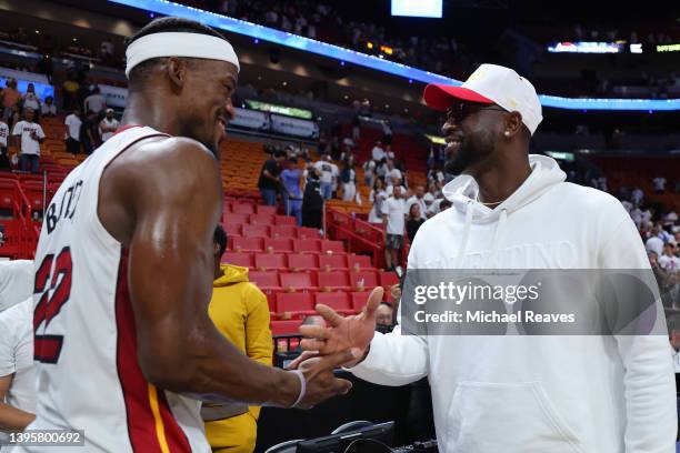 Jimmy Butler of the Miami Heat hugs former Miami Heat player Dwyane Wade after Game Two of the Eastern Conference Semifinals against the Philadelphia...