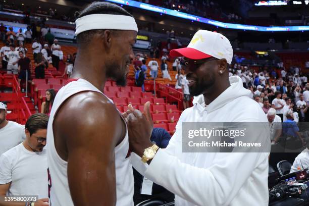 Jimmy Butler of the Miami Heat hugs former Miami Heat player Dwyane Wade after Game Two of the Eastern Conference Semifinals against the Philadelphia...