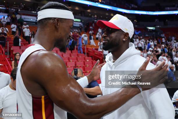 Jimmy Butler of the Miami Heat hugs former Miami Heat player Dwyane Wade after Game Two of the Eastern Conference Semifinals against the Philadelphia...