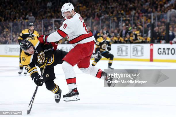 Jordan Staal of the Carolina Hurricanes shoves Connor Clifton of the Boston Bruins during the first period Game Three of the First Round of the 2022...