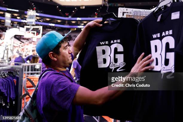 Charles Romero of Phoenix shops for a shirt honoring Brittney Griner before the game between the Phoenix Mercury and the Las Vegas Aces at Footprint...