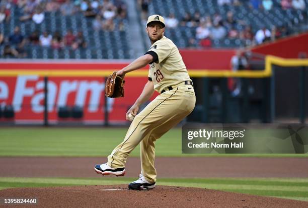 Merrill Kelly of the Arizona Diamondbacks delivers a first inning pitch against the Colorado Rockies at Chase Field on May 06, 2022 in Phoenix,...