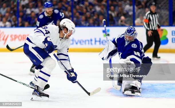 Andrei Vasilevskiy of the Tampa Bay Lightning stops a shot from Auston Matthews of the Toronto Maple Leafs in the third period during Game Three of...