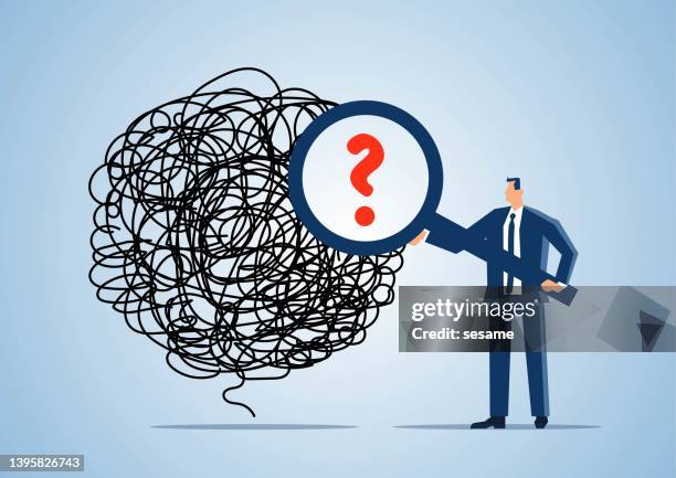 problem finding and solving, trouble and solution, looking for the cause of emotional stress and upset mood, businessman holding magnifying glass to find question mark from messy tangled wad of thread - tangled stock illustrations