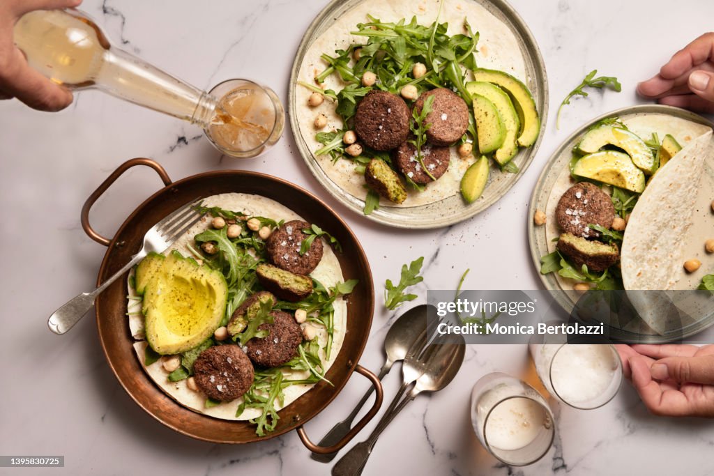 Falafel and pita bread on marble table