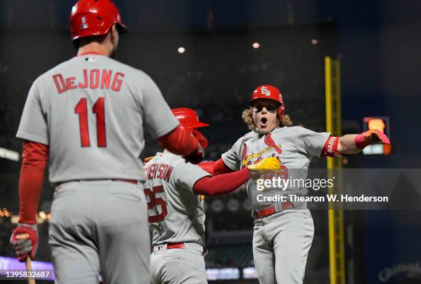 Harrison Bader, Corey Dickerson and Paul DeJong of the St. Louis Cardinals celebrate after Bader hit a two-run home run against the San Francisco...