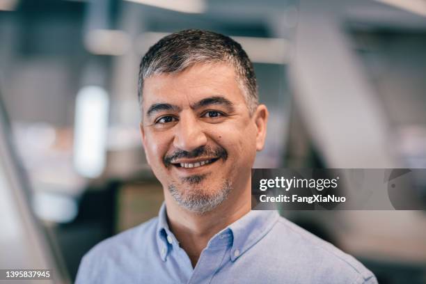 portrait of asian middle eastern man in office setting - handsome middle eastern men bildbanksfoton och bilder