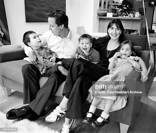 David and Samantha Cameron pictured at their London home with children, Nancy, Arthur and Ivan. The family photograph was used by the Conservative...