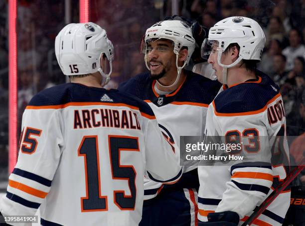 Evander Kane of the Edmonton Oilers celebrates his third goal of the game, a "hat trick", with Josh Archibald and Ryan Nugent-Hopkins during an 8-2...