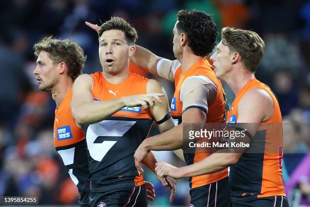 Toby Greene of the Giants celebrates with his team after kicking a goal during the round eight AFL match between the Greater Western Sydney Giants...