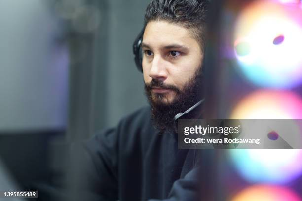headshot of gamer guy concentrate streaming video games online - emotional intelligence stock pictures, royalty-free photos & images