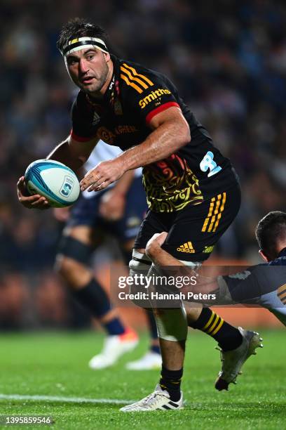 Luke Jacobson of the Chiefs makes a break during the round 12 Super Rugby Pacific match between the Chiefs and the ACT Brumbies at FMG Stadium...