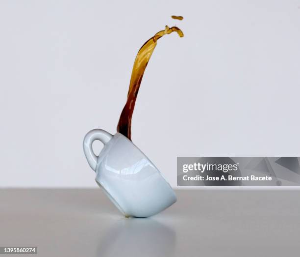 splashes and stains from a cup of coffee dropped on the floor. - broken cup stock-fotos und bilder