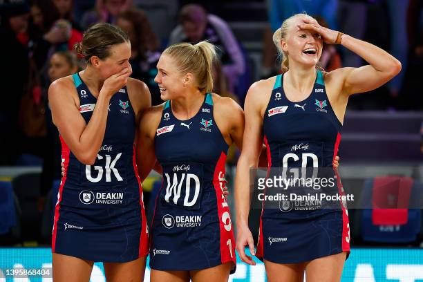 Olivia Lewis, Kate Moloney and Jo Weston of the Vixens celebrat winning the round eight Super Netball match between Melbourne Vixens and Queensland...