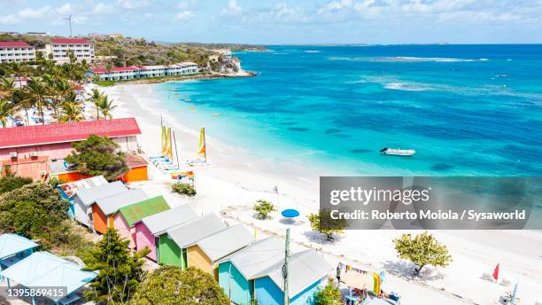 turquoise lagoon facing a white sand beach, antigua - island hut stock pictures, royalty-free photos & images