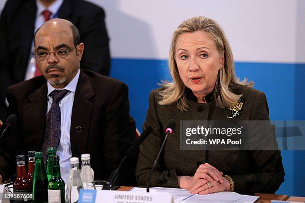 Secretary of State Hillary Clinton makes an address flanked by Ethiopia Prime Minister Meles Zenawi during the Somalia Conference at Lancaster House...