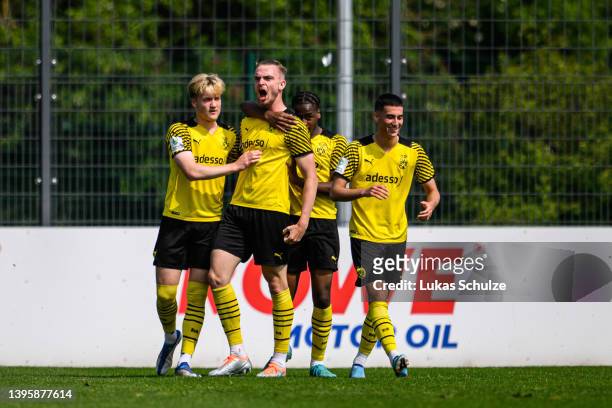 Scorer Bradley Thomas Fink of Dortmund celebrates his site's first goal with team mates during A Junior German Championship Semi Final Leg One match...