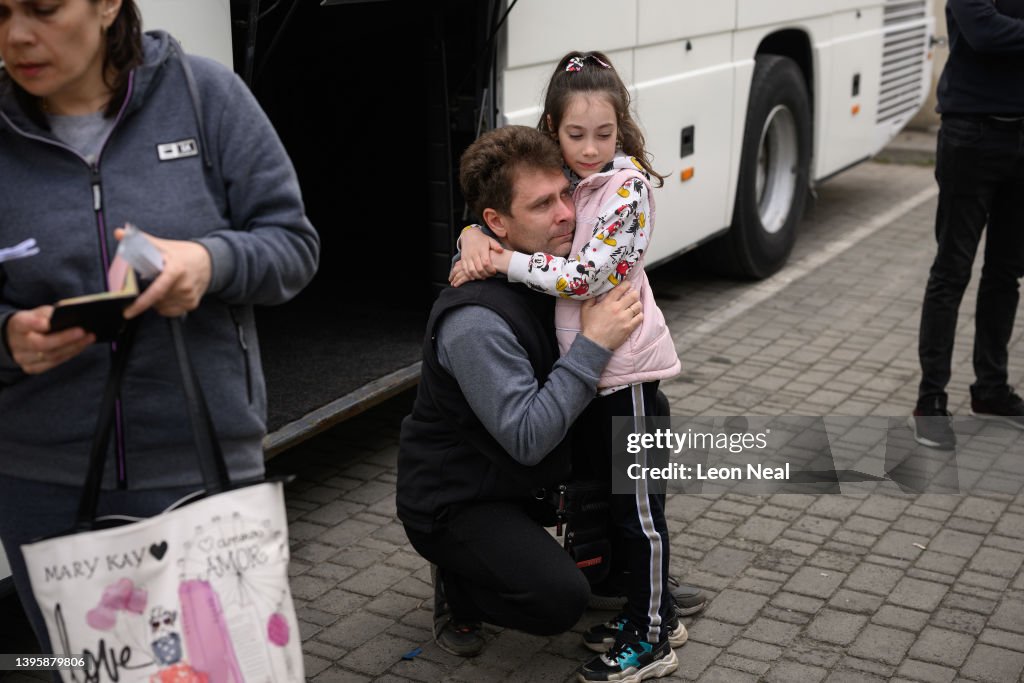 Yevchenko Eugene Yevchenko cries as he bids farewell to his daughter Maria at a ...