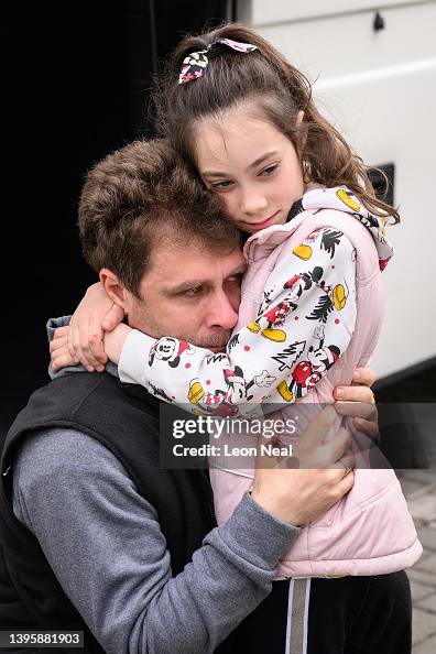 Yevchenko Eugene Yevchenko cries as he bids farewell to his daughter Maria at a ...