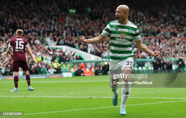 Daizen Maeda of Celtic celebrates after scoring their team's first goal during the Cinch Scottish Premiership match between Celtic and Heart of...