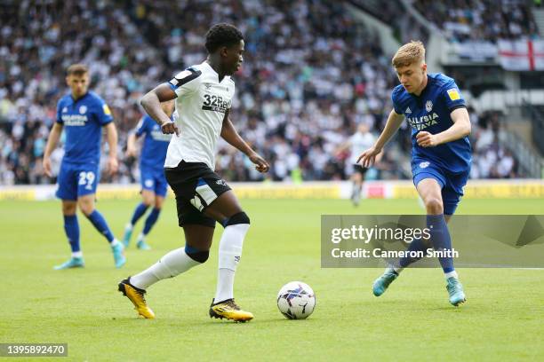 Curtis Davies of Derby County is challenged by Joel Bagan of Cardiff City during the Sky Bet Championship match between Derby County and Cardiff City...