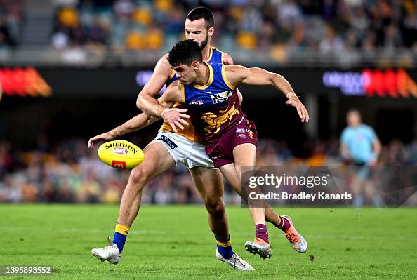 Josh Rotham Charlie Cameron of the Lions and Josh Rotham of the Eagles challenge ...