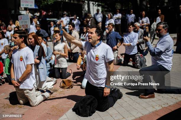 Several people kneel and pray during an anti-abortion march from Plaza de Cuzco to the Dator clinic on May 7 in Madrid, Spain. This mobilization,...