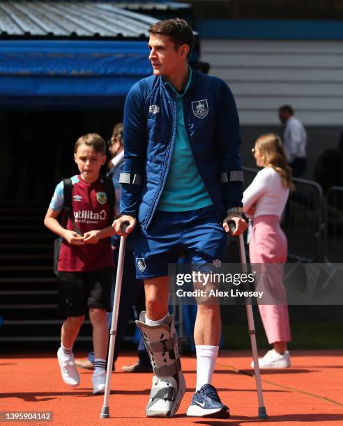 Ashley Westwood of Burnley arrives at the stadium on crutches prior to the Premier League match between Burnley and Aston Villa at Turf Moor on May...