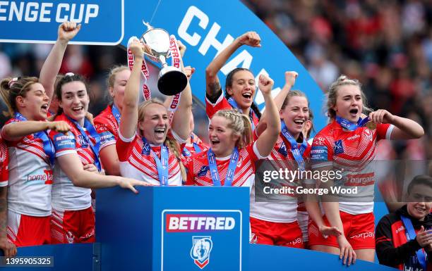 Jodie Cunningham of St Helens lifts the Challenge Cup trophy following victory in the Betfred Women's Super League Grand Final match between Leeds...
