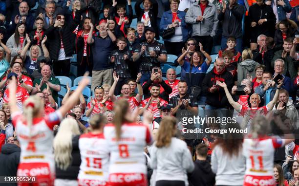 St Helens fans celebrate following victory in the Betfred Women's Super League Grand Final match between Leeds Rhinos and St Helens at Elland Road on...