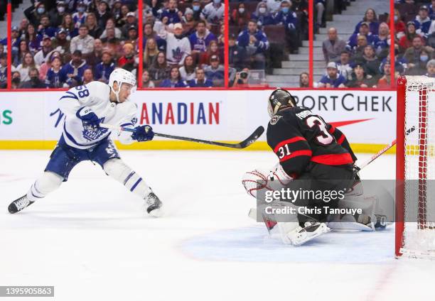 Michael Bunting of the Toronto Maple Leafs shoots the puck on Anton Forsberg of the Ottawa Senators at Canadian Tire Centre on April 16, 2022 in...