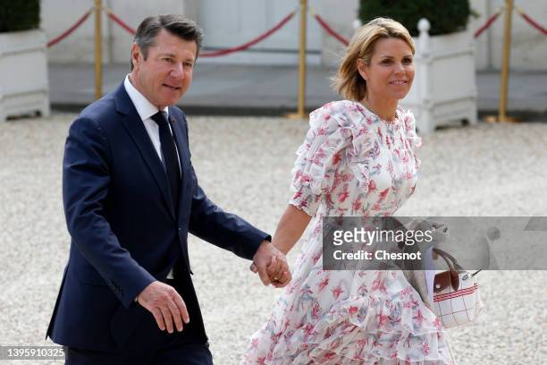 French mayor of Nice Christian Estrosi and his wife Laura Tenoudji arrive at the Elysee presidential palace to attend the investiture ceremony of...