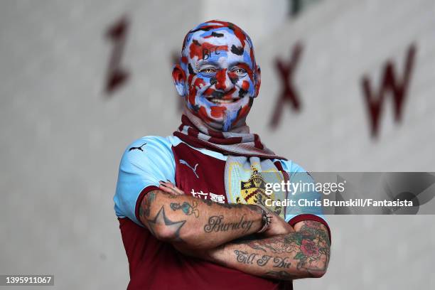 Burnley fan looks on during the Premier League match between Burnley and Aston Villa at Turf Moor on May 07, 2022 in Burnley, England.