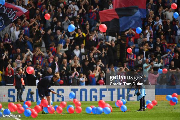 Crystal Palace fans throw balloons onto the pitch prior to the Premier League match between Crystal Palace and Watford at Selhurst Park on May 07,...