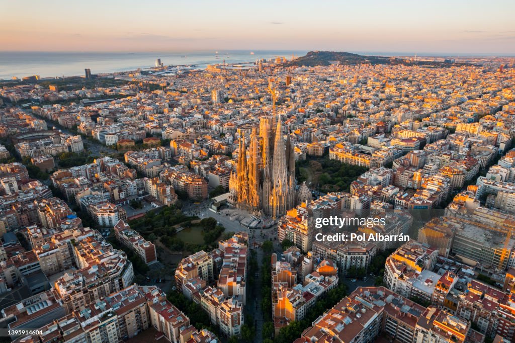 Barcelona City Skyline with Sagrada Familia Cathedral at sunrise. Catalonia, Spain. Aerial view