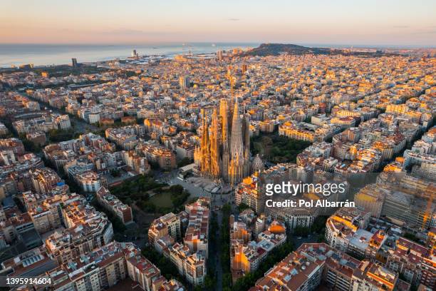 barcelona city skyline with sagrada familia cathedral at sunrise. catalonia, spain. aerial view - barcelona spain stock pictures, royalty-free photos & images