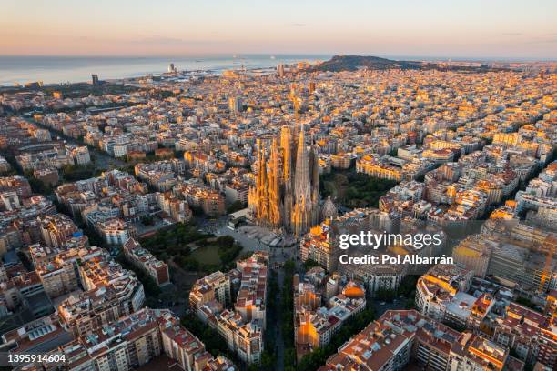 barcelona city skyline with sagrada familia cathedral at sunrise. catalonia, spain. aerial view - sagrada família imagens e fotografias de stock