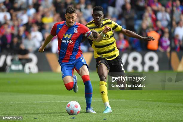 Joel Ward of Crystal Palace is challenged by Ismaila Sarr of Watford FC during the Premier League match between Crystal Palace and Watford at...